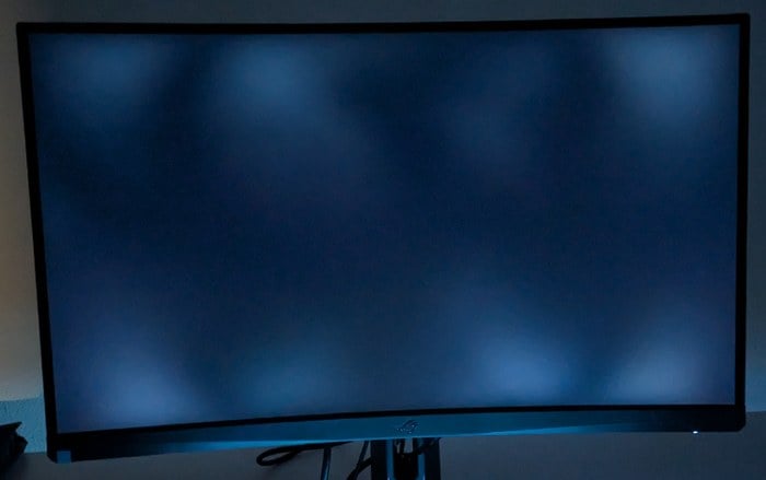 Backlight bleed patches along the edge of a monitor screen