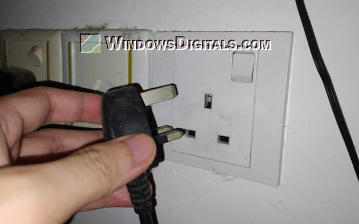 Disconnect power plug from socket