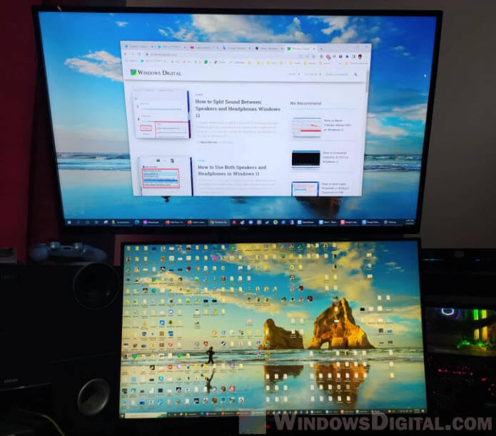 How do I display different things on two monitors Windows 11